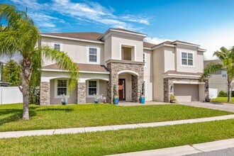 Building Photo - Spacious 6-Bedroom Home Near Lake Nona | 3-Car Garage + Tesla Charger