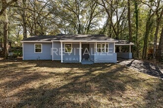 Building Photo - 3 BR 2 BA Home with Fenced Yard & Carport