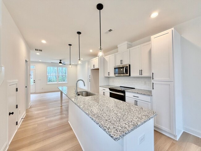 Building Photo - **OFFERING 1/2 OFF FIRST MONTH'S RENT** Newly Built 4BD, 3.5BA End-Unit Raleigh Townhome in a Gre...