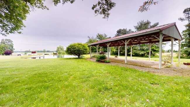 Building Photo - County living with pond & out buildings
