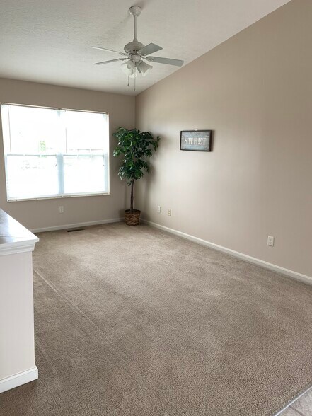Upstairs living room has two large windos that let tons of lights in. - 6869 Gordon Blvd