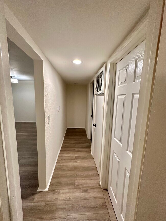 Hallway leading to bedrooms, includes storage area as well. - 5303 Alhama Dr