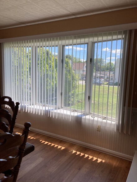 dining area with brand new vertical blinds - 741 Ferdinand St