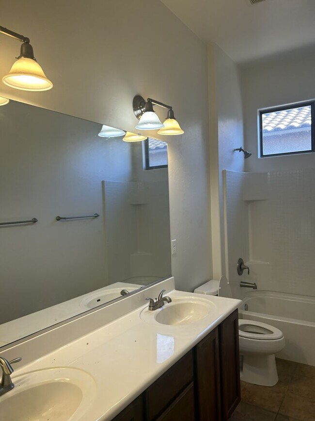 Building Photo - Unfurnished four bedroom large home!  Three car garage