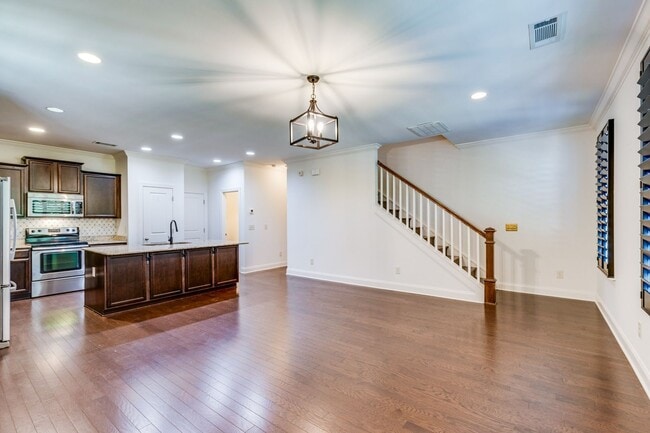 Building Photo - Welcome to this charming end unit townhome