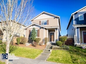 Building Photo - Spacious 4-Bedroom Home with Fenced Yard & 2-Car Garage Near JBLM!