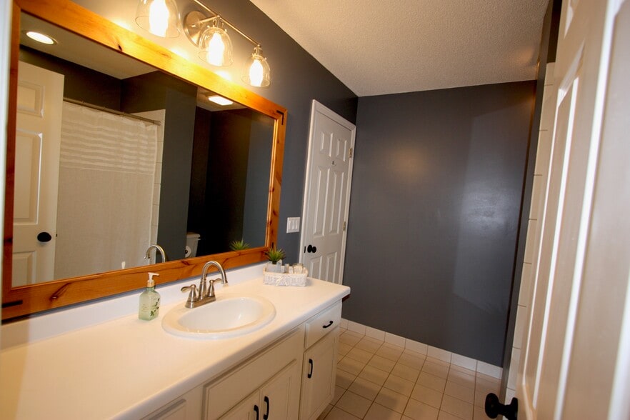 Second level full bathroom attached to master bedroom. - 15805 24th Ave N.