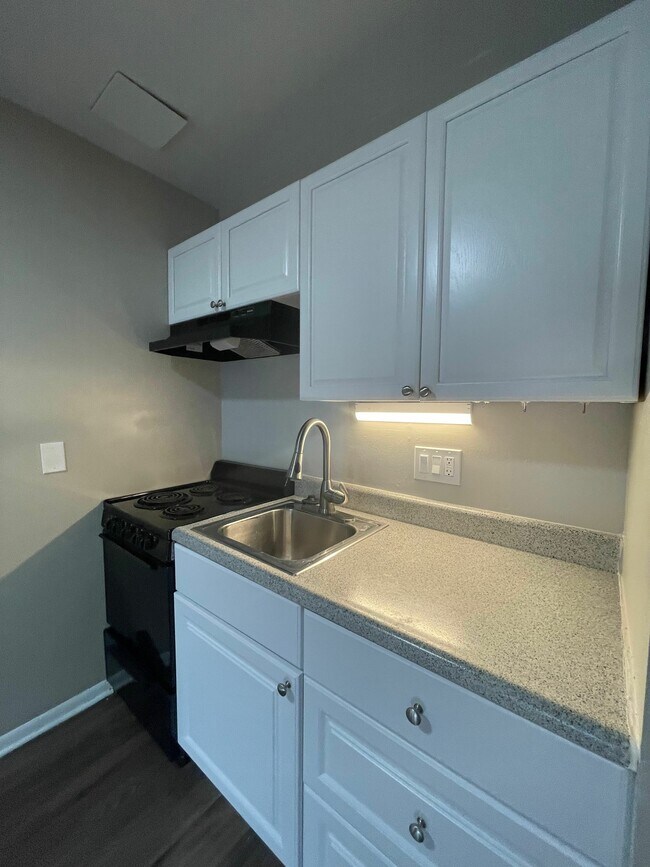 Experience elegant simplicity in this beautifully designed kitchen corner. - GRACE LANDINGS APARTMENTS