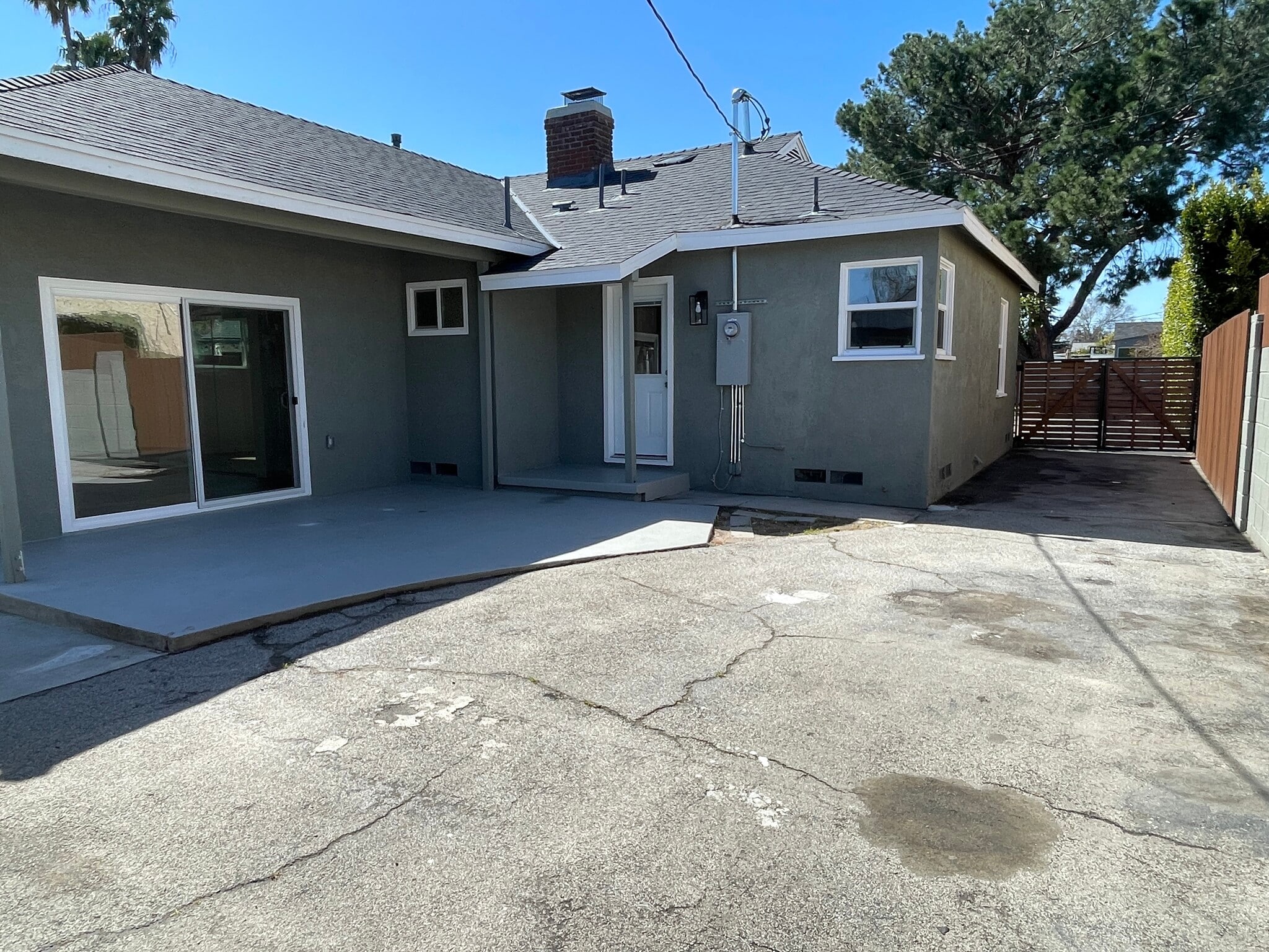 Back off house with patio right outside main bedroom and long driveway - 5950 Simpson Ave