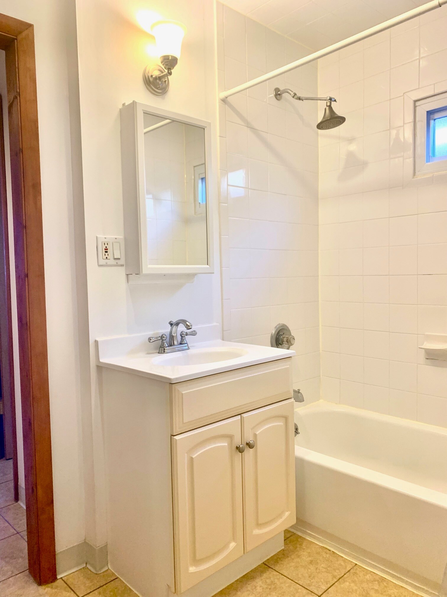 Primary Bedroom vanity, medicine cabinet and tub - 203 5th St