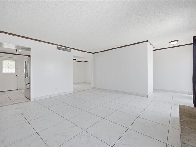 Building Photo - Concept Living with Large Enclosed Backyard & Modern Upgrades!