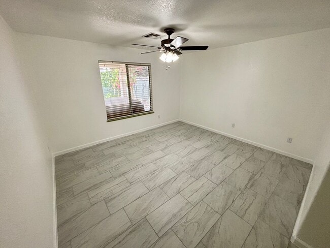 Building Photo - This inviting single-story home boasts a s...