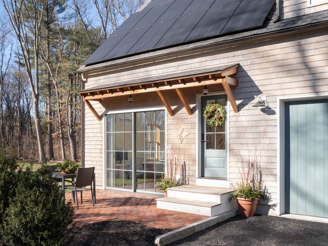 Winter view of entry and patio - 399 Lowell Rd