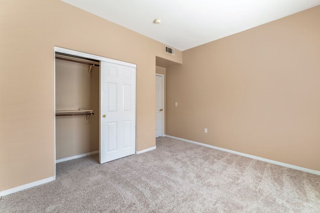 Building Photo - Bright & Stylish Condo with Fireplace and Private Balcony in a Resort-Style Community!