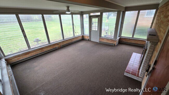 Building Photo - Charming Mid-Century 2BR Home with Sunroom, Fireplace & Fenced Yard