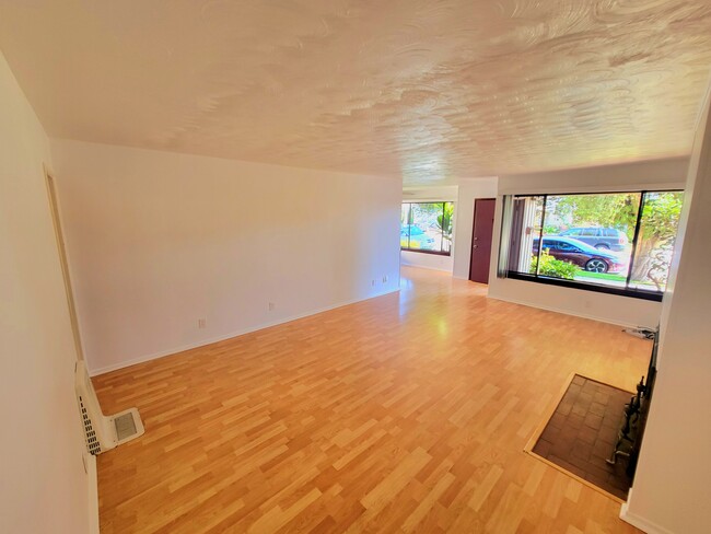 View of LIVING room towards Dining room, coat closet, and entry - 12051 Alberta Dr