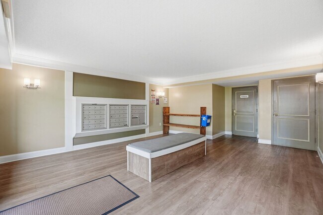 Building Photo - This expansive ground level residence is set within a serene, gated garden community surrounded b...