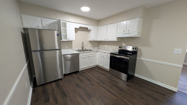 Building Photo - Fenced Yard, Lots of Light, Hard Floors Throughout