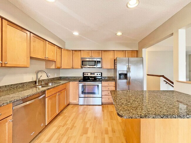 Building Photo - Beautifully Redone Modern Townhome with Large Deck, 2-Car Garage, Granite Kitchen, Vaulted Ceilin...