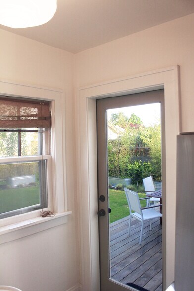 Access your private deck and backyard through a full-light door onto the deck. - 2635 NE 30th Ave