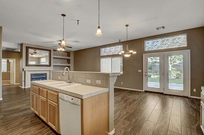 Building Photo - Gorgeous NW Single Story! 3 Car Garage! Serene Backyard.