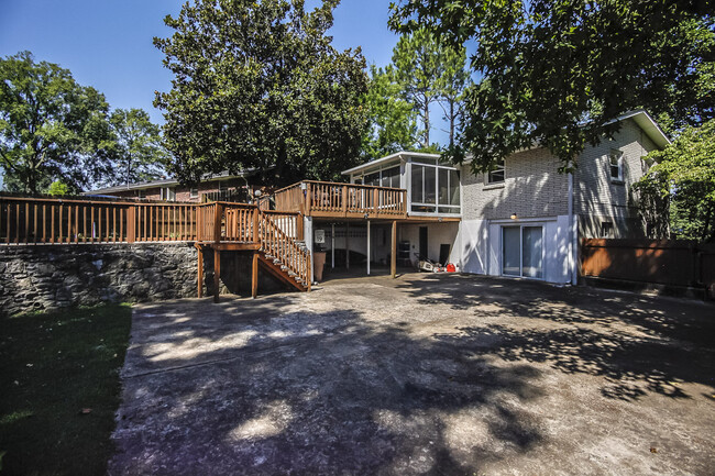 Photo 31. Steps from the Pool lead down to a two-car carport, driveway, entrance door to lower level - 1623 Lethia Dr