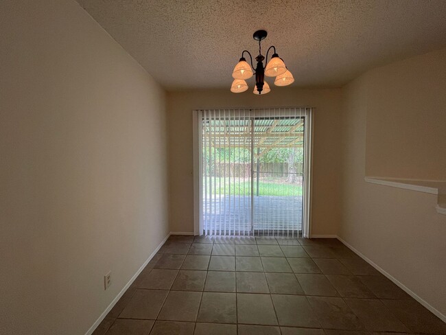 Building Photo - SPACIOUS HOME - NEW FLOORING! - 2 LIVING A...