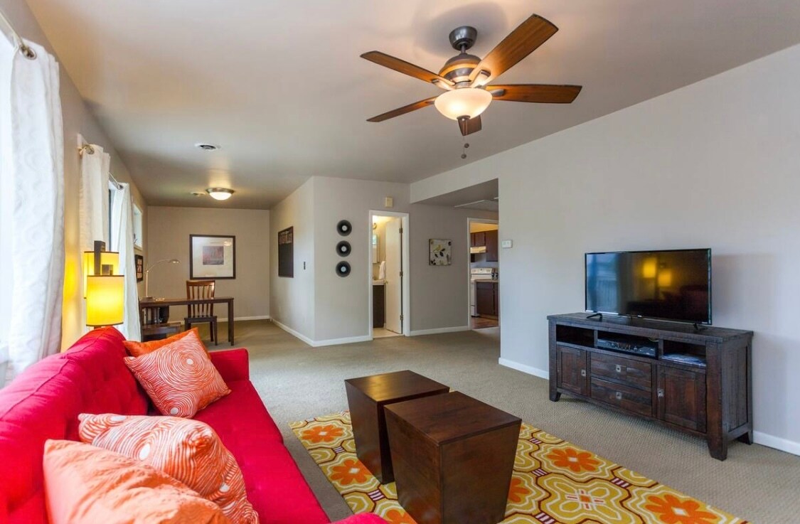 Living room with a view of the office nook, bath, kitchen and hallway - 1709 Villa Pl