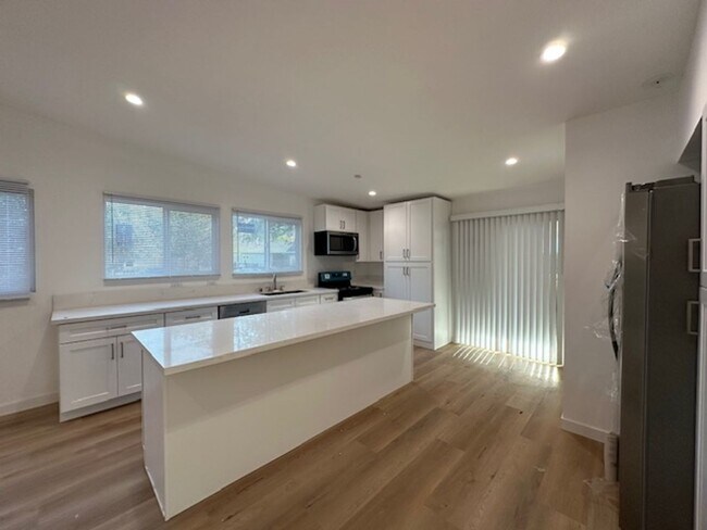 Building Photo - Completely remodeled 4+2 sprawled across a...