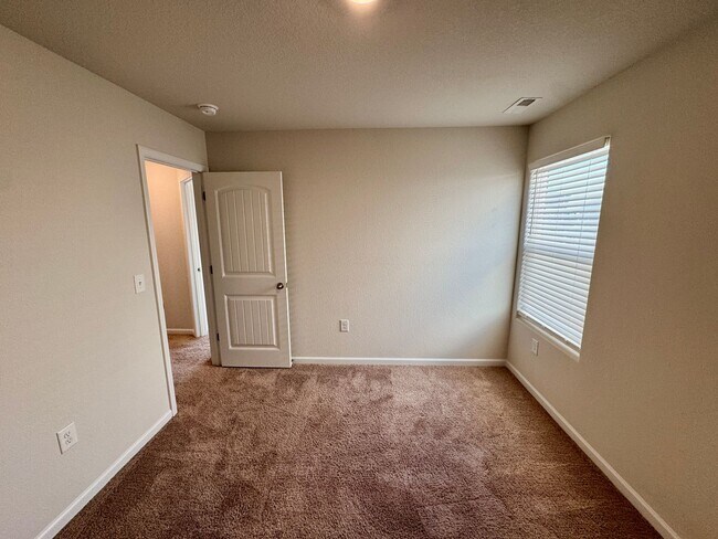 Building Photo - Located in Creedmore Hills a 4BR/2.5BA home with 2 car garage