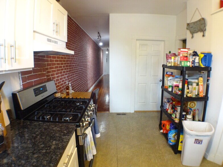 Kitchen looking back down the hallway towards the front door. - 2 Bay Street