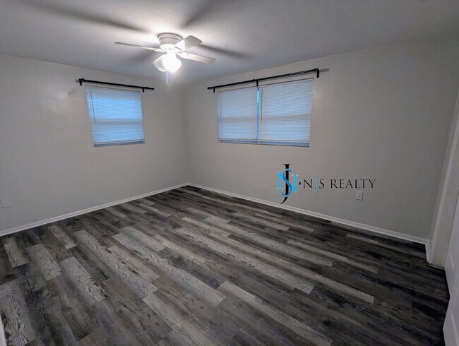 Building Photo - NEW FLOORS, NEW PAINT INSIDE & OUT.. 2/1/1...