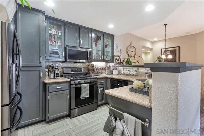 Building Photo - MOVE-IN SPECIAL $500 OFF! Otay Ranch - Gorgeous 2 Bed/2 Bath Condo with Garage