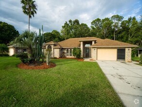 Building Photo - Charming Home in Spruce Creek Fly In!