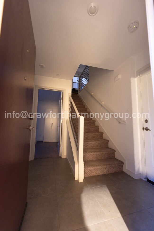 Inviting entryway to the bi-level townhome. - 459 Lug Ln