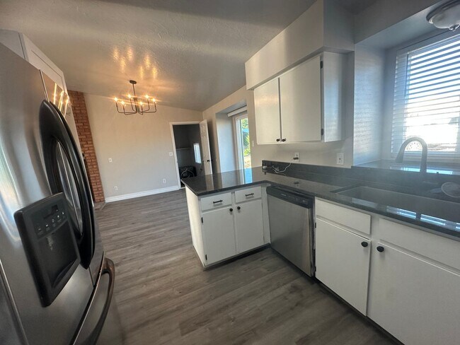 Building Photo - Quiet neighborhood, 3 bedroom, 2 bath home, huge front patio/deck, RV parking!