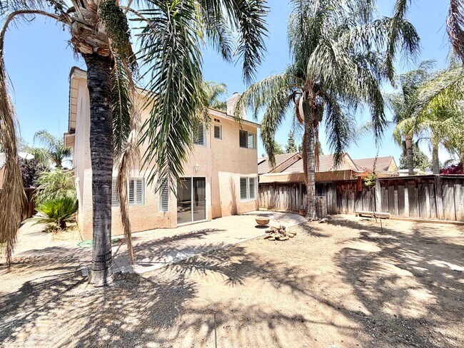 Building Photo - Open-Concept 3 Bedroom 2.5 Bathroom Home with Soaring Ceilings & Spacious Backyard
