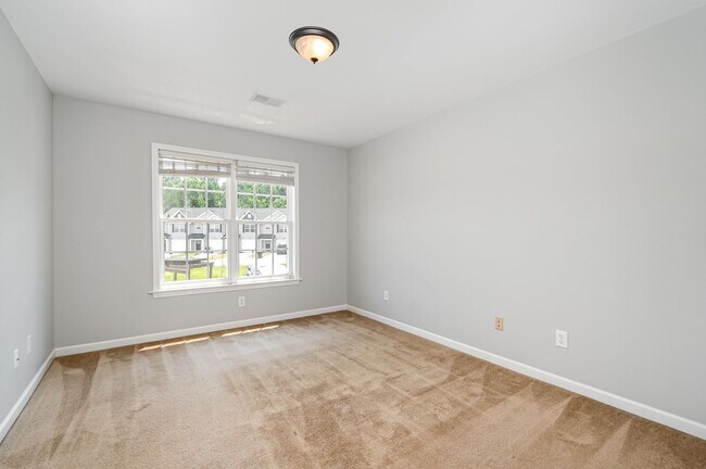 Building Photo - Spacious 2-Story Townhome with Finished Ba...