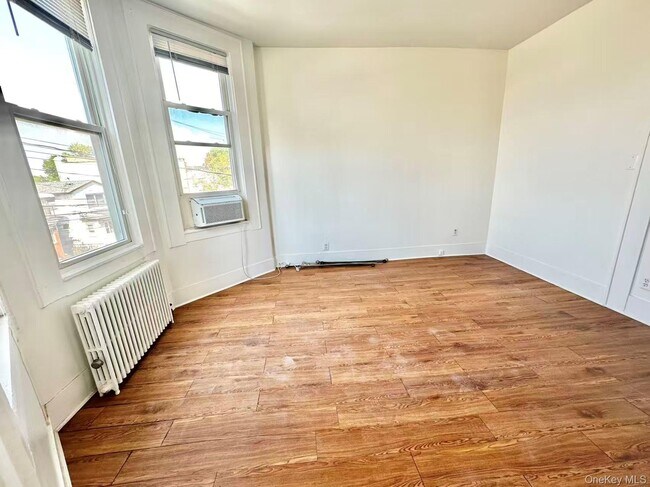 Building Photo - 18-17 125th St
