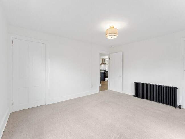 Building Photo - Renovated 3-Bedroom Apartment with Bonus Finished Attic & Spacious Shared Backyard
