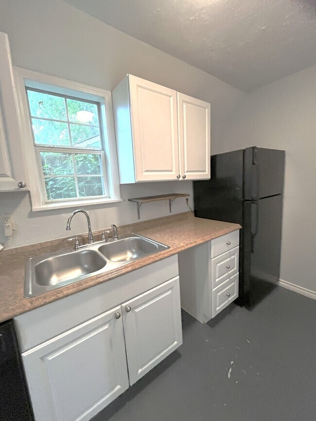 Kitchen with double sink, and view of full size refrigerator - 1127 Walling St