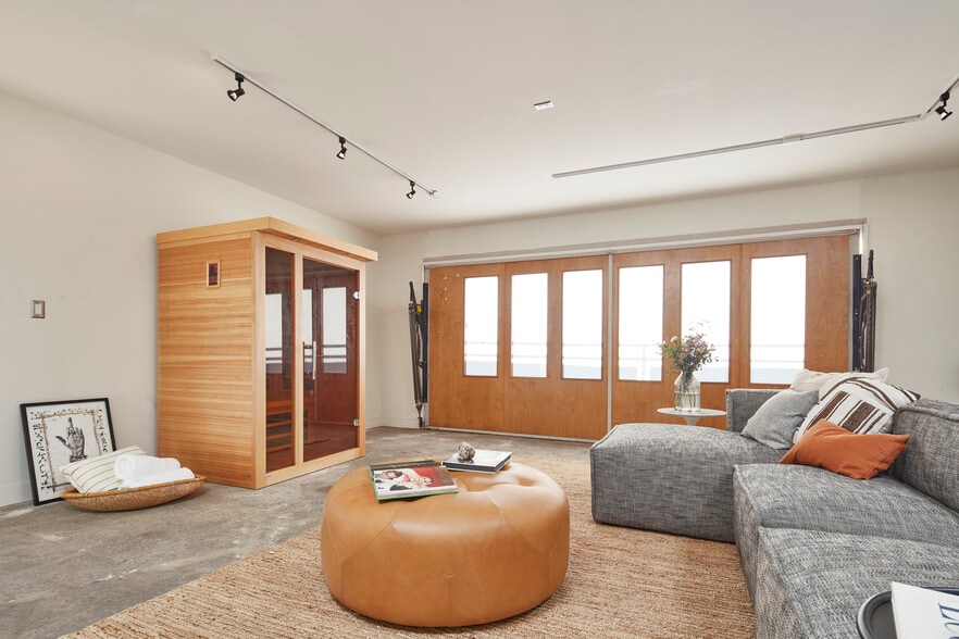 A finished air-conditioned garage offers ideal office / creative space opportunities - 703 Palms Blvd