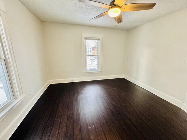 Building Photo - "Spacious 6-Bedroom Gem with Gleaming New Hardwood Floors in Minneapolis!"