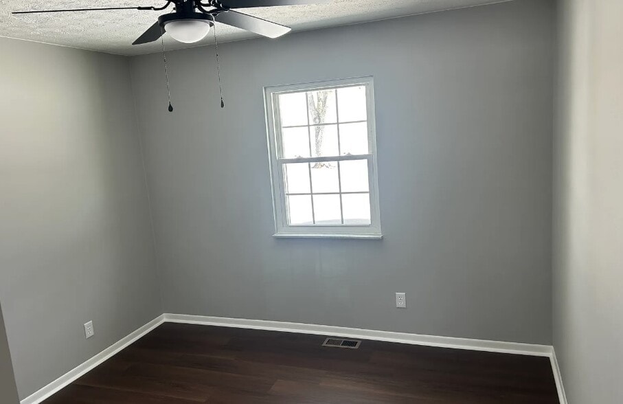 Bedroom #2 with new fixture and flooring - 2751 Hart Rd