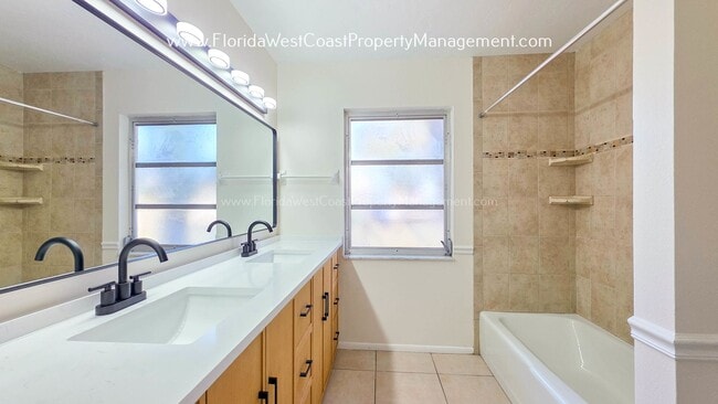 Building Photo - SPACIOUS SARASOTA HOME WITH LARGE FENCED YARD! MOVE IN READY! ALL TILE/ NEW LVP!