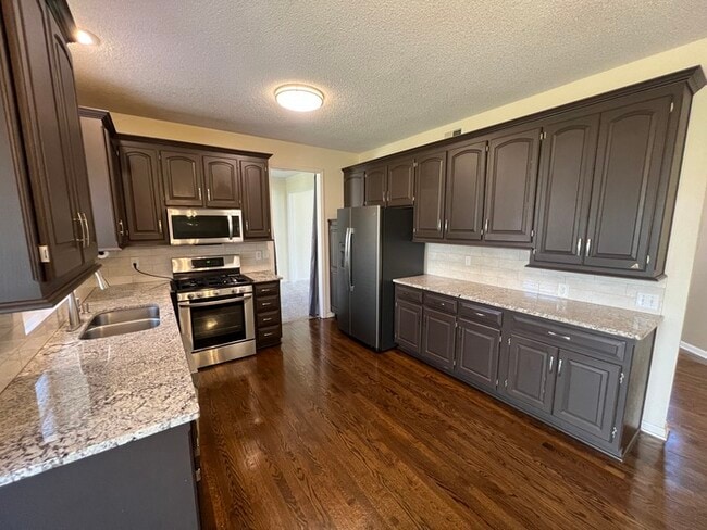 Building Photo - Welcome to this beautiful 4-bedroom, 2.5-b...