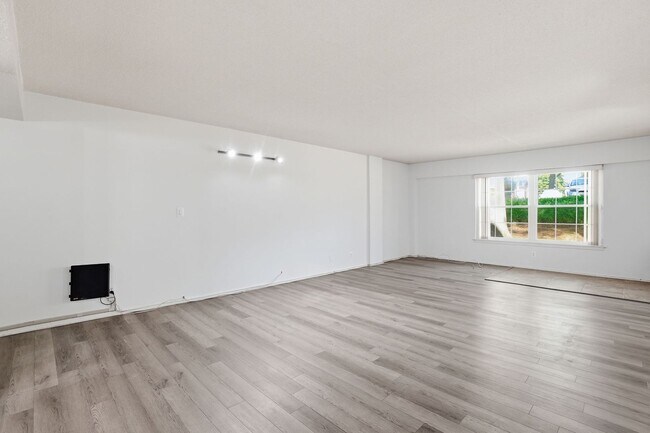 Building Photo - This expansive ground level residence is set within a serene, gated garden community surrounded b...