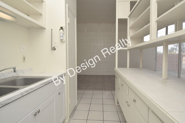 Building Photo - Sun-Drenched Mid-Century Living Near Garden District