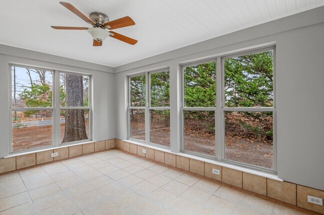 Building Photo - Brick home, Two Story, Hardwoods, DR, 2 Sun Rooms, FP, Carport!.