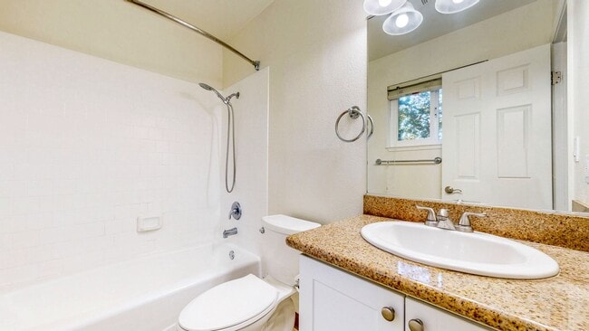 Building Photo - Cozy 1 bedroom 1 bath end unit condo with 1 car garage and private patio located next to Peterson...